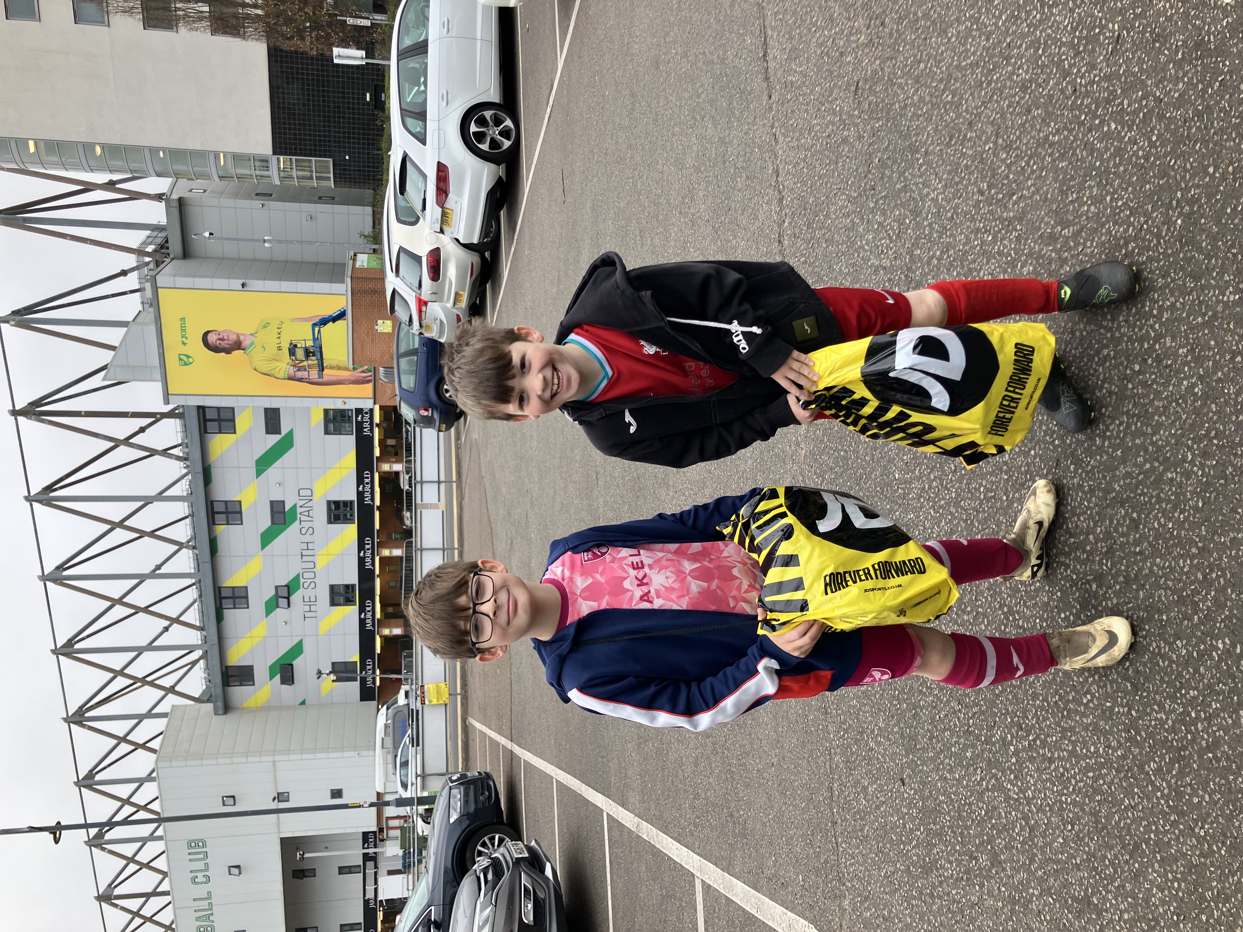 Kit and Leo outside the South Stand at Carrow Road
